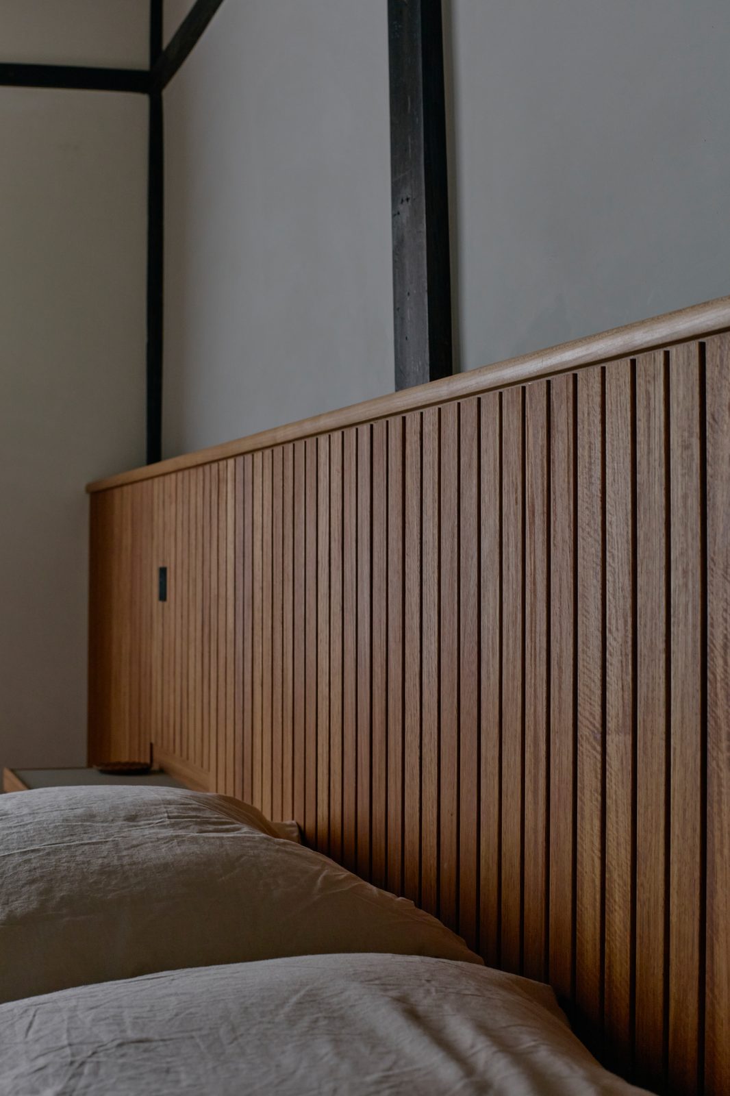 Bedroom with exposed timber ceiling and fusuma