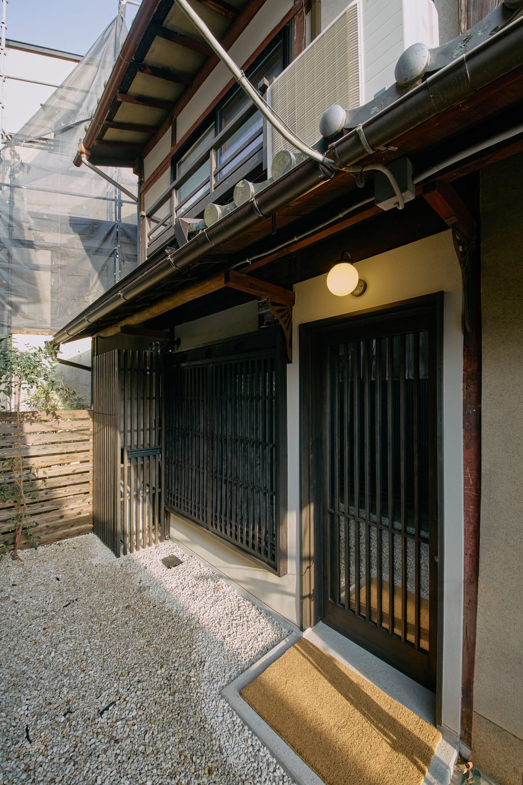 Exterior entry with soot-darkened timber