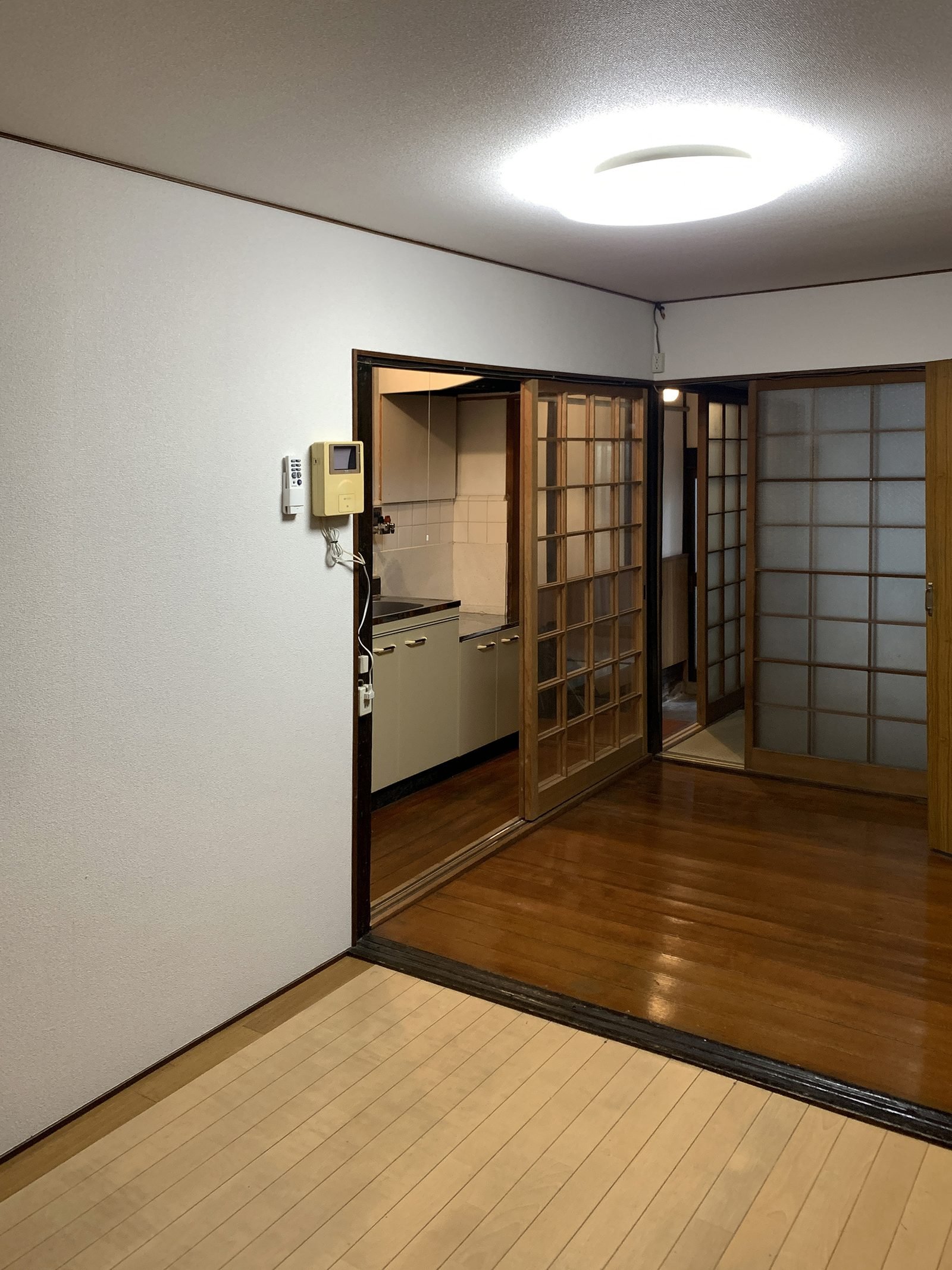Original downstairs living area with dropped ceiling