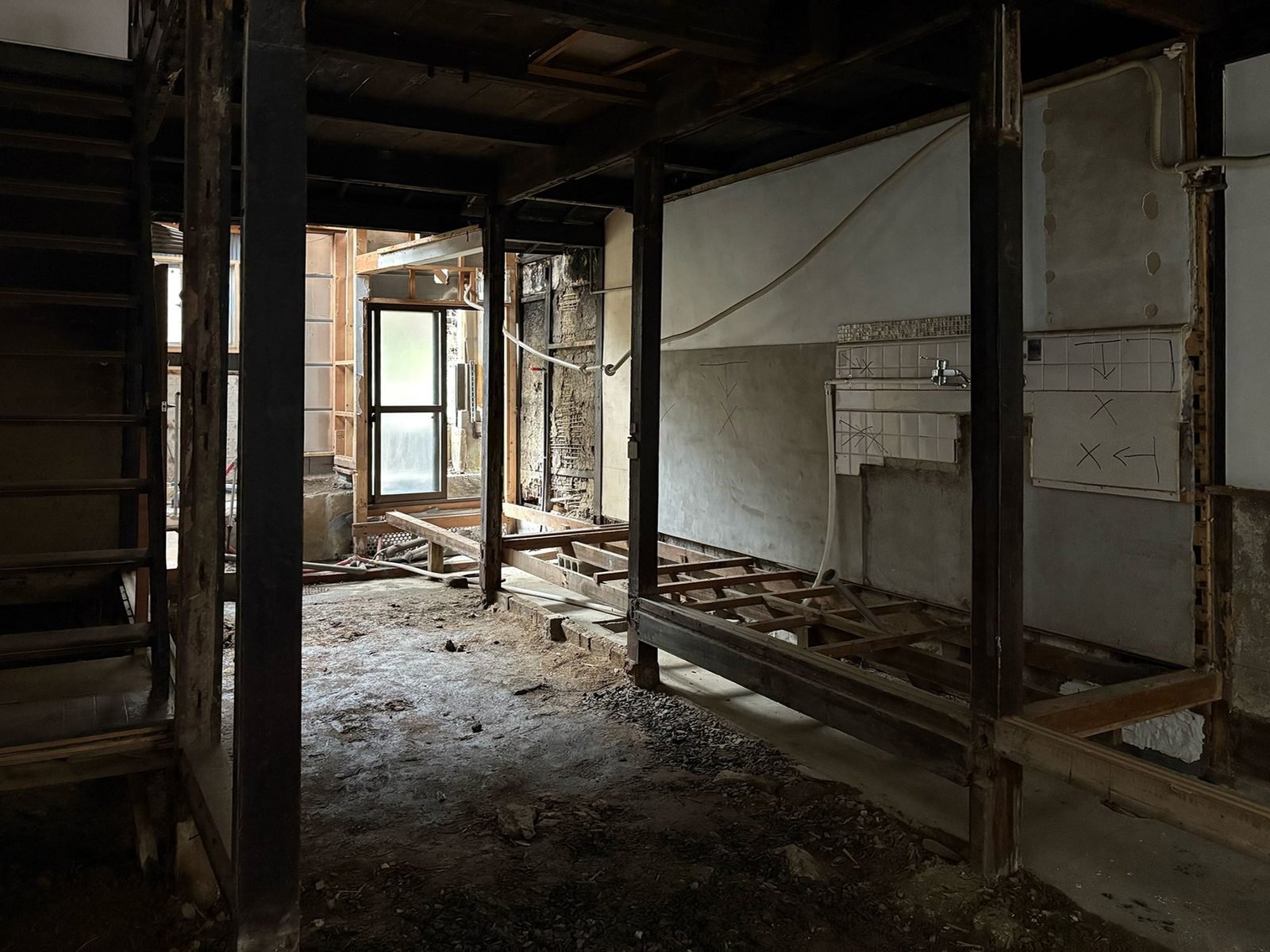 Exposed floor joists and contractor planning marks