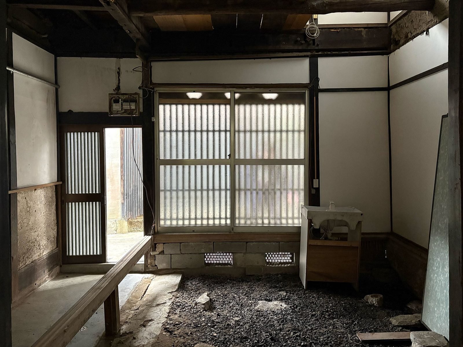 Ground floor stripped to earth, timber frame exposed